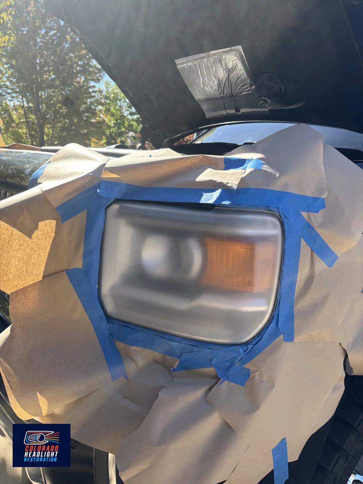 Truck headlight restoration — sanding in progress