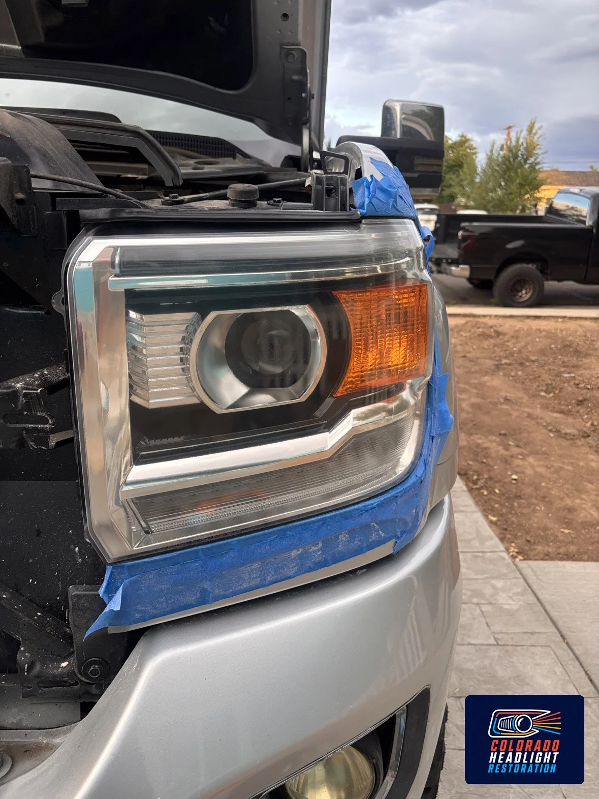 Pickup headlight lens with paper and blue tape masking