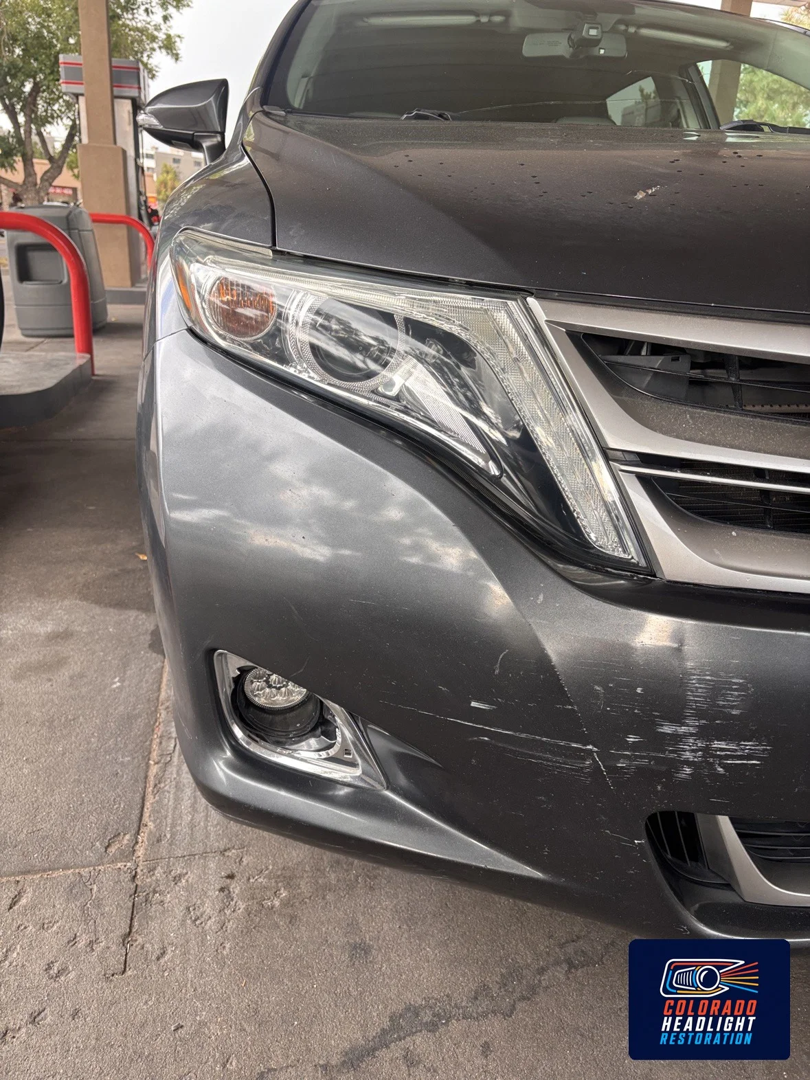 Gray SUV front corner showing a clear headlight lens