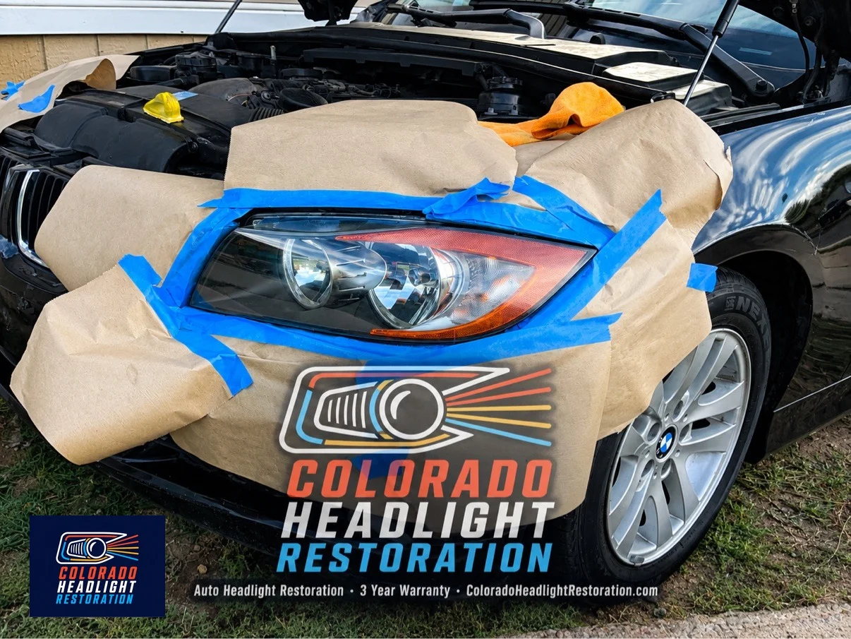 BMW headlight restoration — protective masking during the job